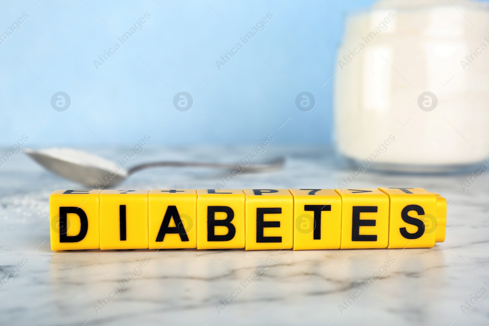 Photo of Word DIABETES made of cubes on table