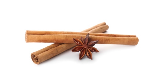 Aromatic cinnamon sticks and anise isolated on white