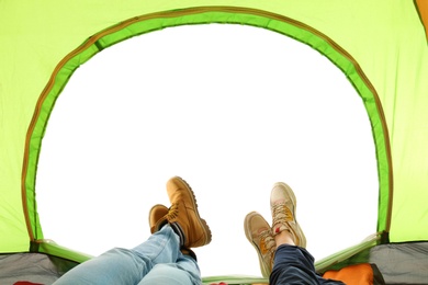 Photo of Closeup of couple in camping tent on white background, view from inside