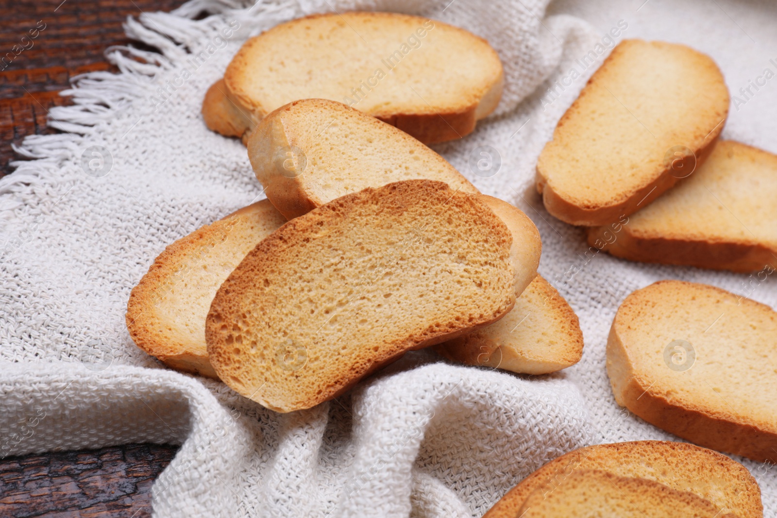 Photo of Tasty hard chuck crackers on wooden table