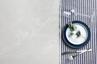 Photo of Elegant table setting on grey marble table, flat lay. Space for text