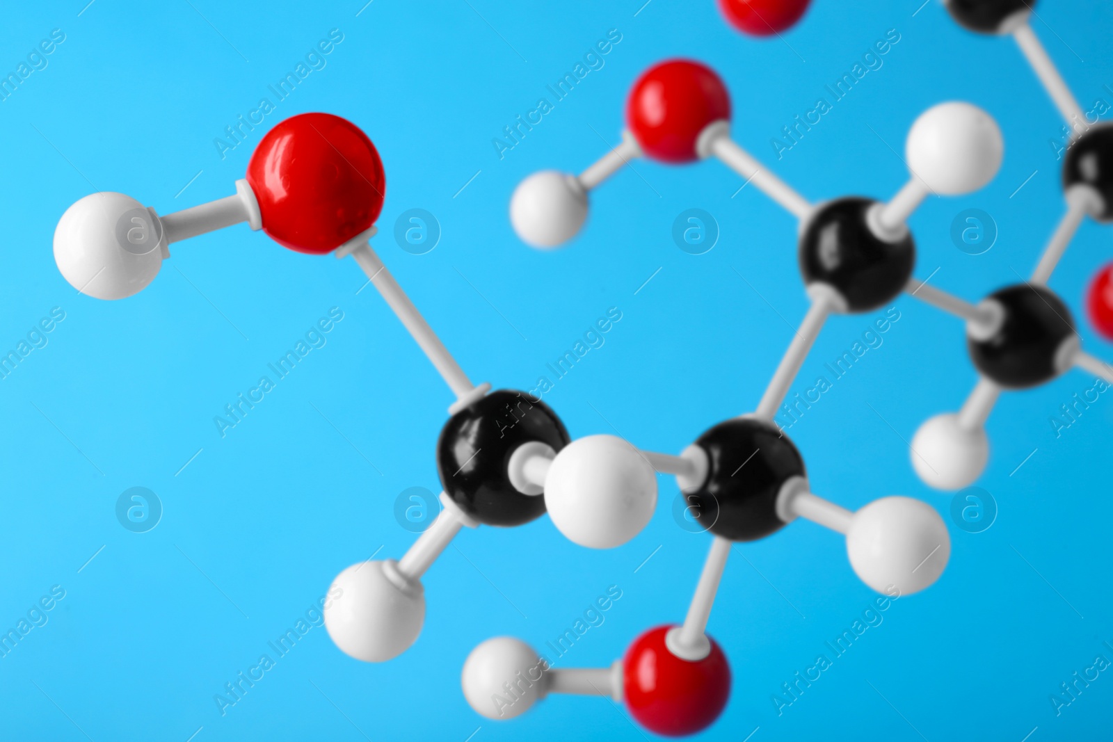 Photo of Molecule of glucose on light blue background, closeup. Chemical model