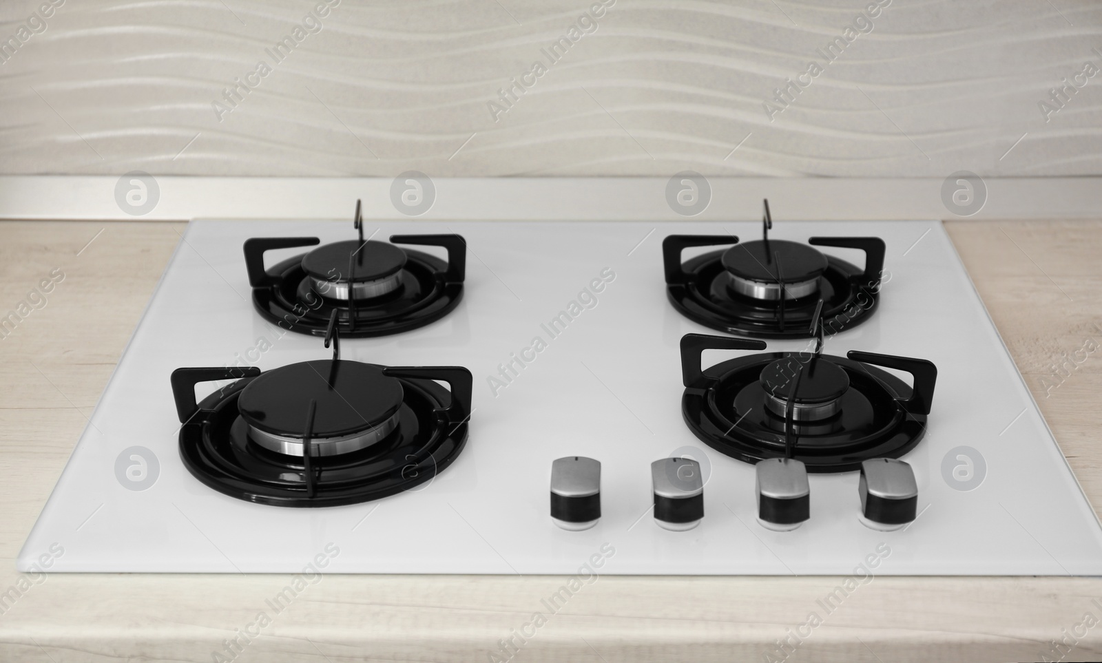 Photo of Modern built-in gas cooktop. Kitchen appliance