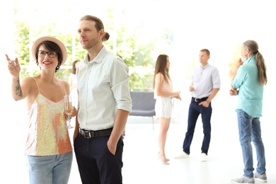 Young couple at exhibition in art gallery