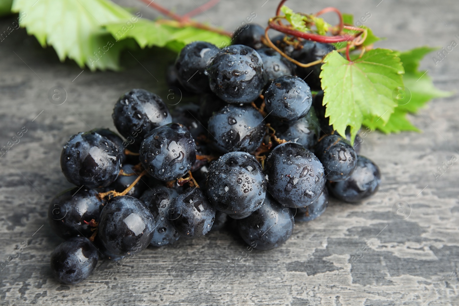 Photo of Fresh ripe juicy grapes on table. Wine ingredient