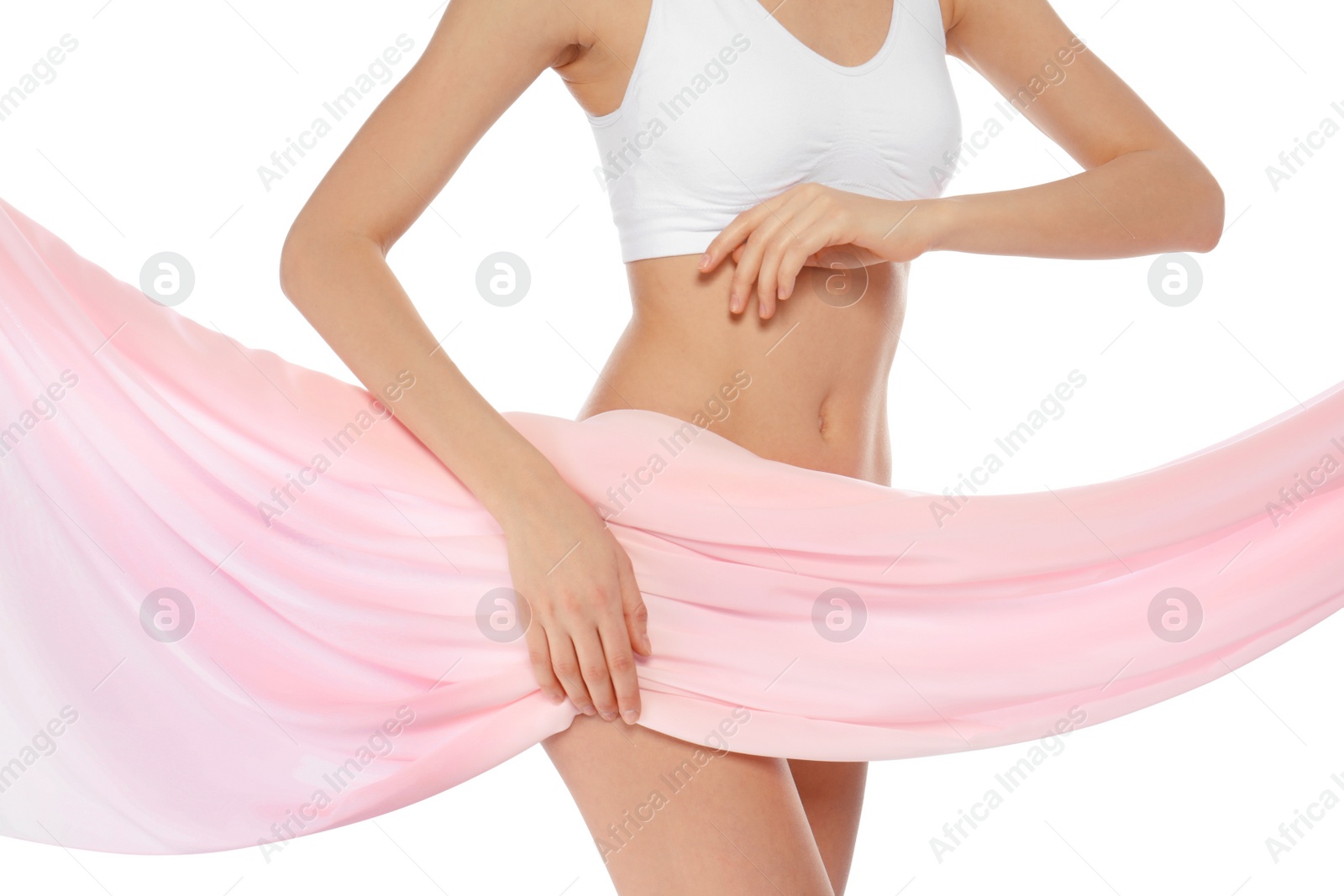 Photo of Young woman with perfect smooth skin and soft fabric on white background, closeup of belly. Beauty and body care