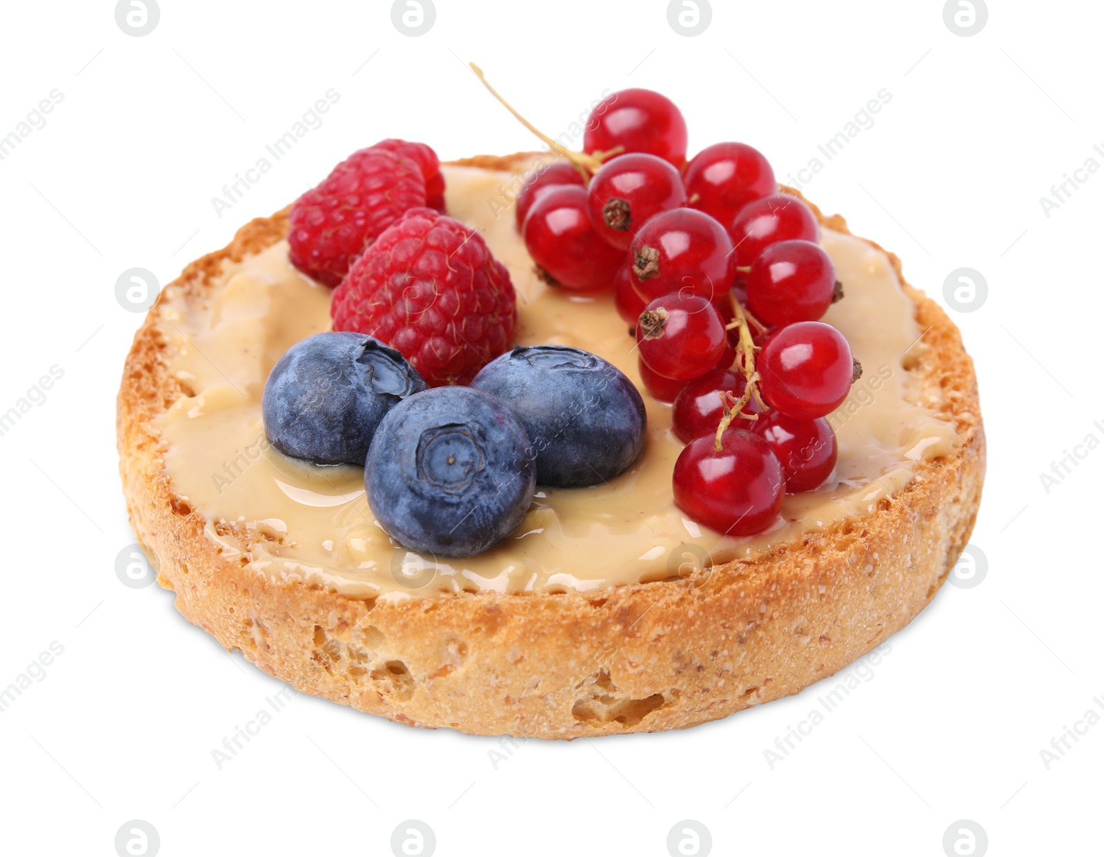 Photo of Tasty organic rusk with peanut butter and sweet berries isolated on white