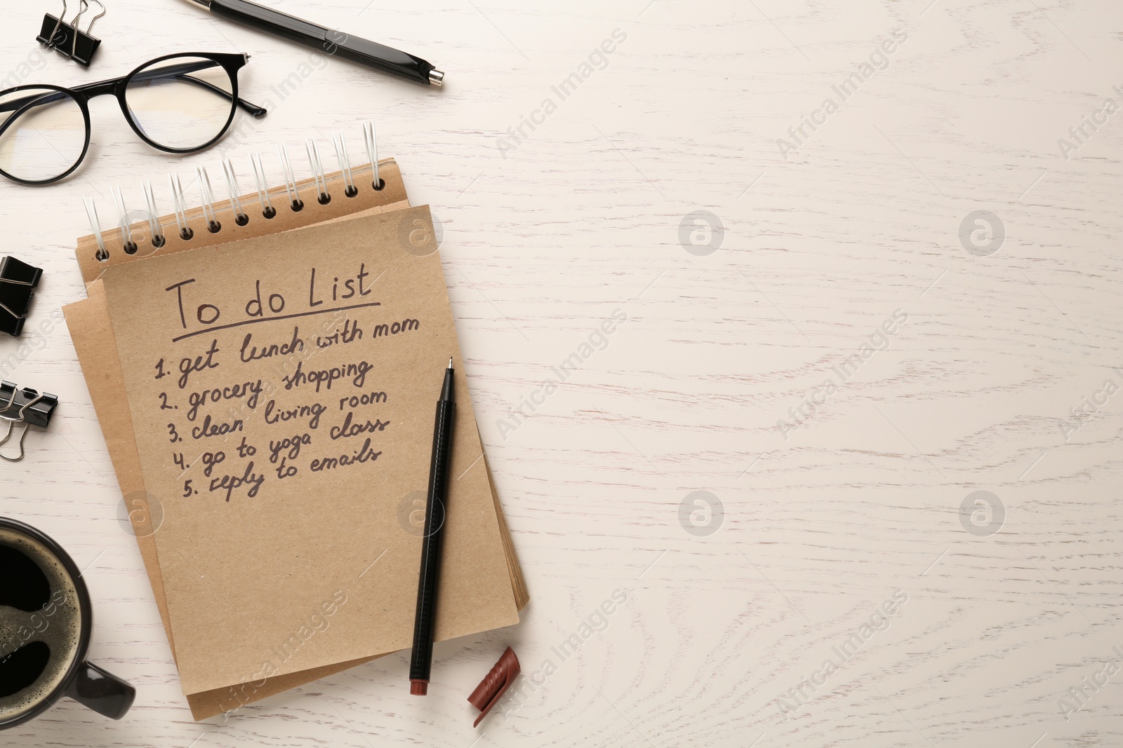 Photo of Flat lay composition with to do list on wooden table, space for text