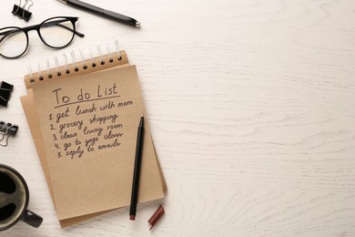 Photo of Flat lay composition with to do list on wooden table, space for text