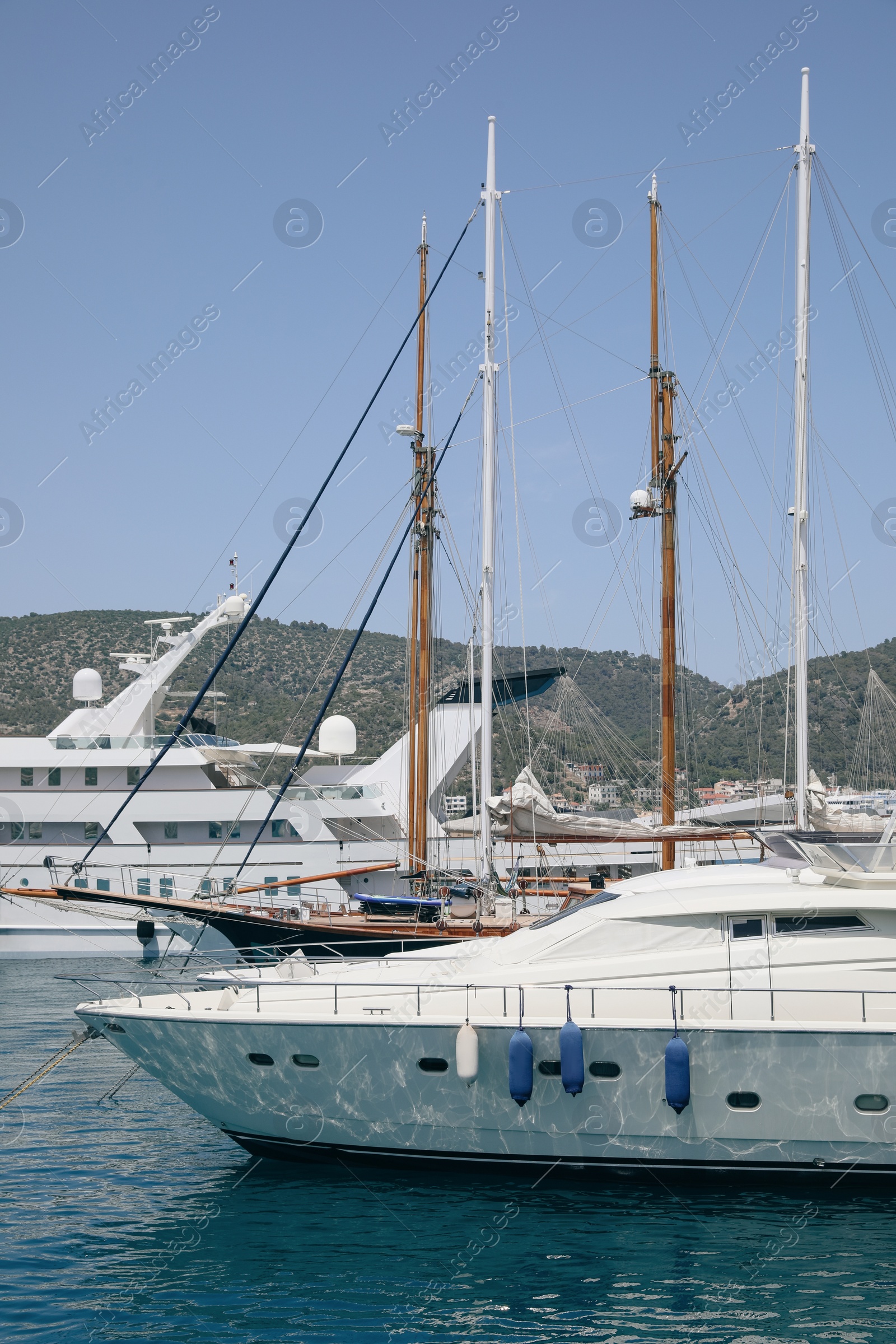 Photo of Beautiful view of different boats in sea near shore on sunny day