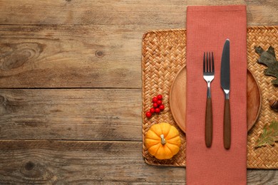 Photo of Autumn table setting, pumpkin and dry leaves, flat lay. Space for text