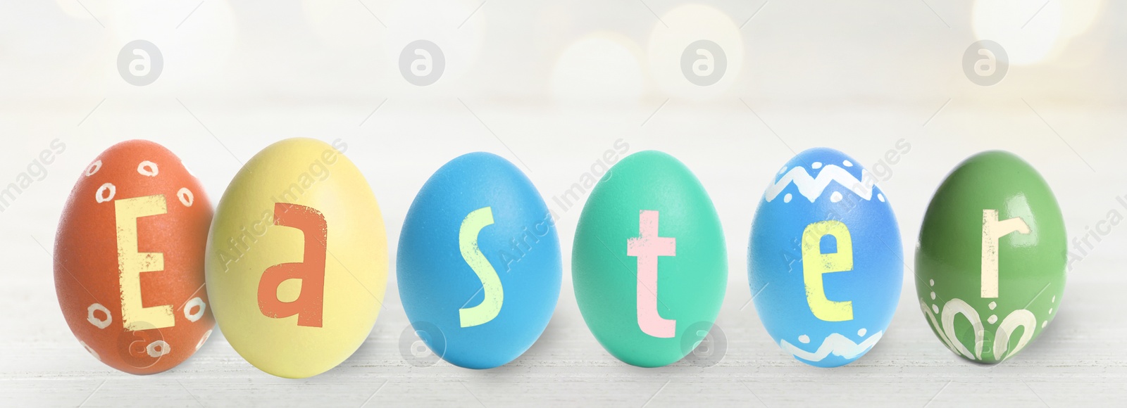 Image of Happy Easter. Colorful dyed eggs on light background, banner design