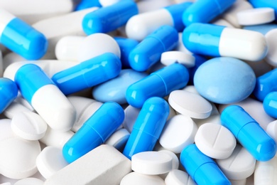 Photo of Assorted pills as background, closeup. Medical treatment