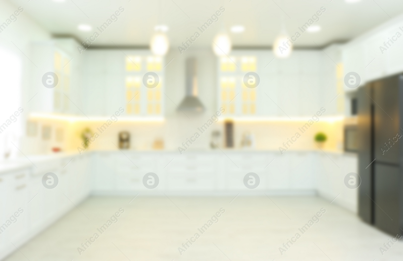 Photo of Blurred view of modern kitchen interior with stylish furniture