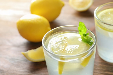 Natural lemonade with mint in glass on table, closeup