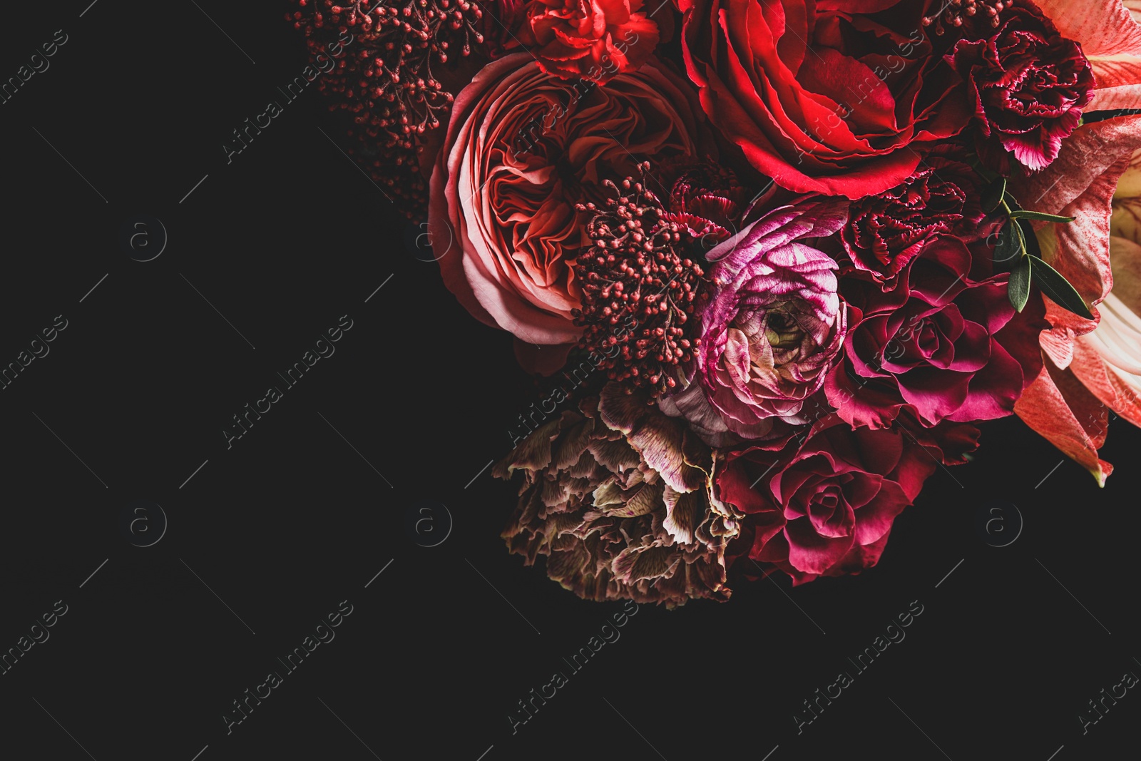 Photo of Beautiful bouquet of different flowers on black background, space for text. Floral card design with dark vintage effect