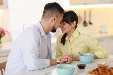 Lovely couple spending time together during breakfast at home