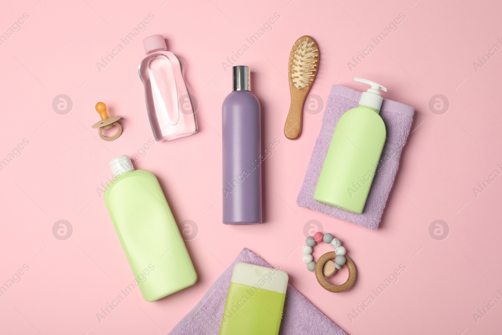 Photo of Flat lay composition with baby cosmetic products on pink background