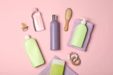 Flat lay composition with baby cosmetic products on pink background