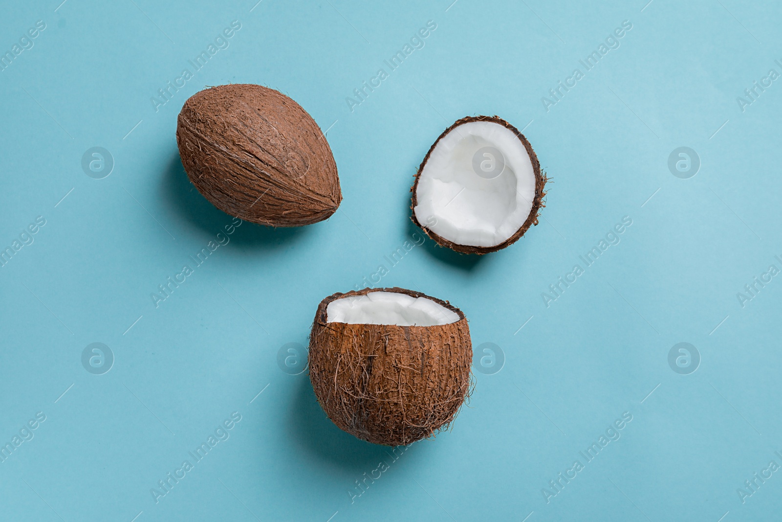 Photo of Ripe coconuts on color background