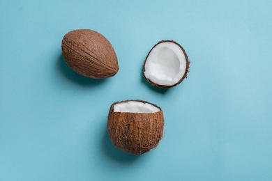 Photo of Ripe coconuts on color background