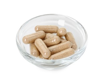 Photo of Vitamin capsules in bowl isolated on white. Health supplement