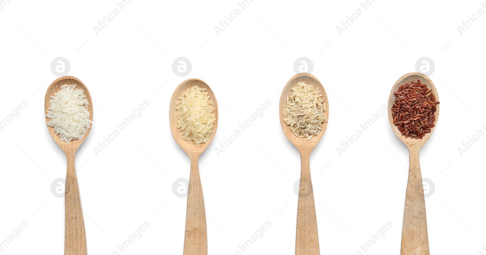 Photo of Spoons with different types of uncooked rice on white background, top view