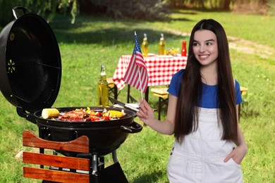4th of July - Independence day of America. Happy girl with national flag of United States having picnic in park