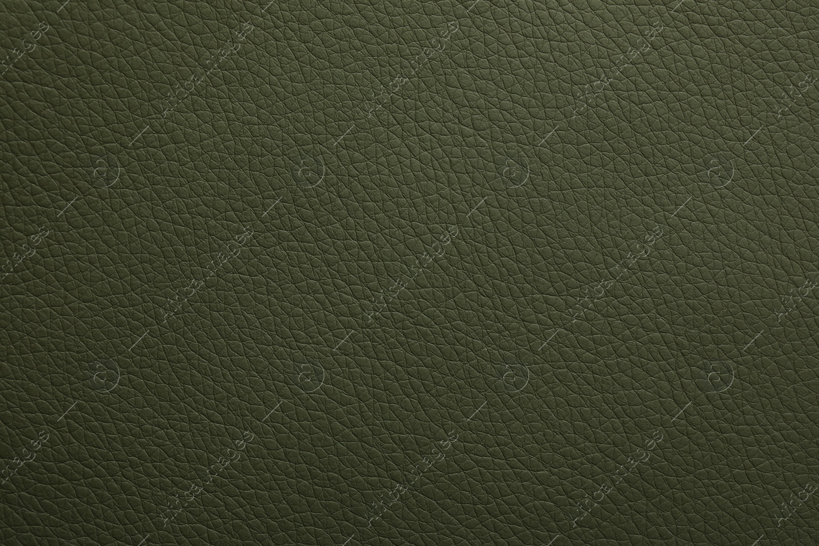 Photo of Texture of dark green leather as background, closeup