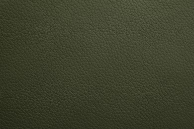 Photo of Texture of dark green leather as background, closeup