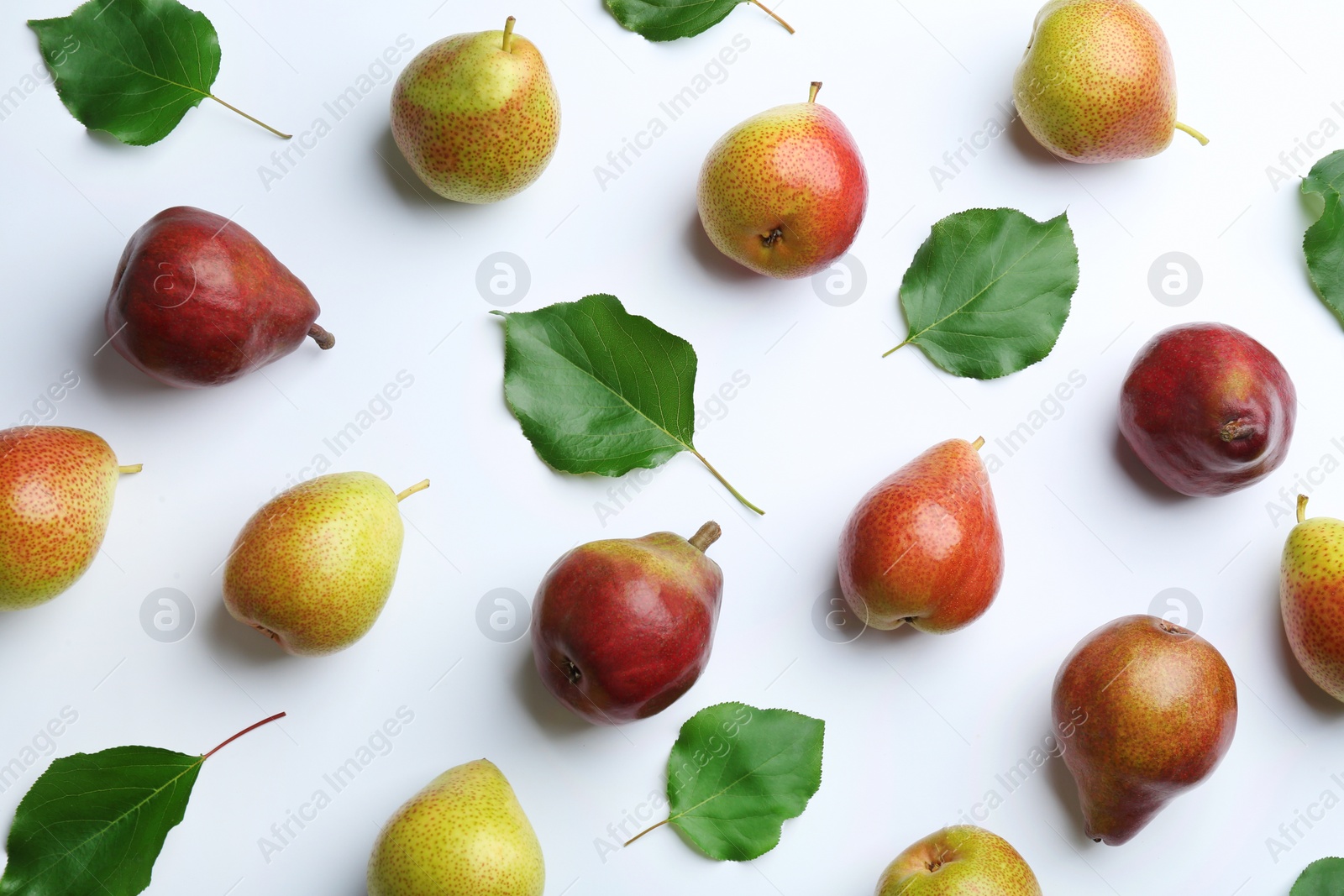 Photo of Ripe juicy pears on white background, top view