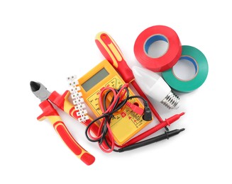 Photo of Set of electrician's tools and accessories on white background, top view