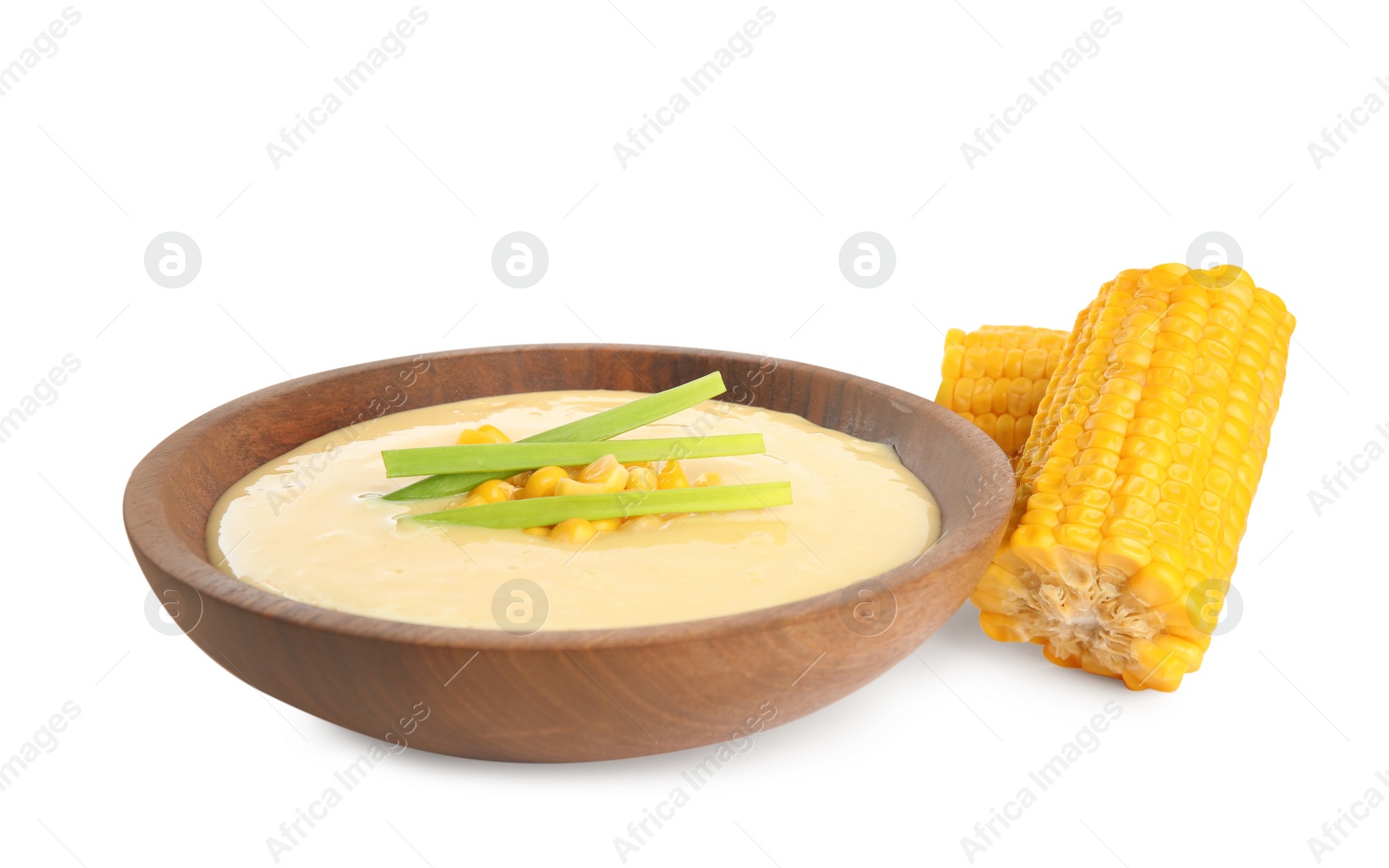 Photo of Delicious corn cream soup and cobs on white background