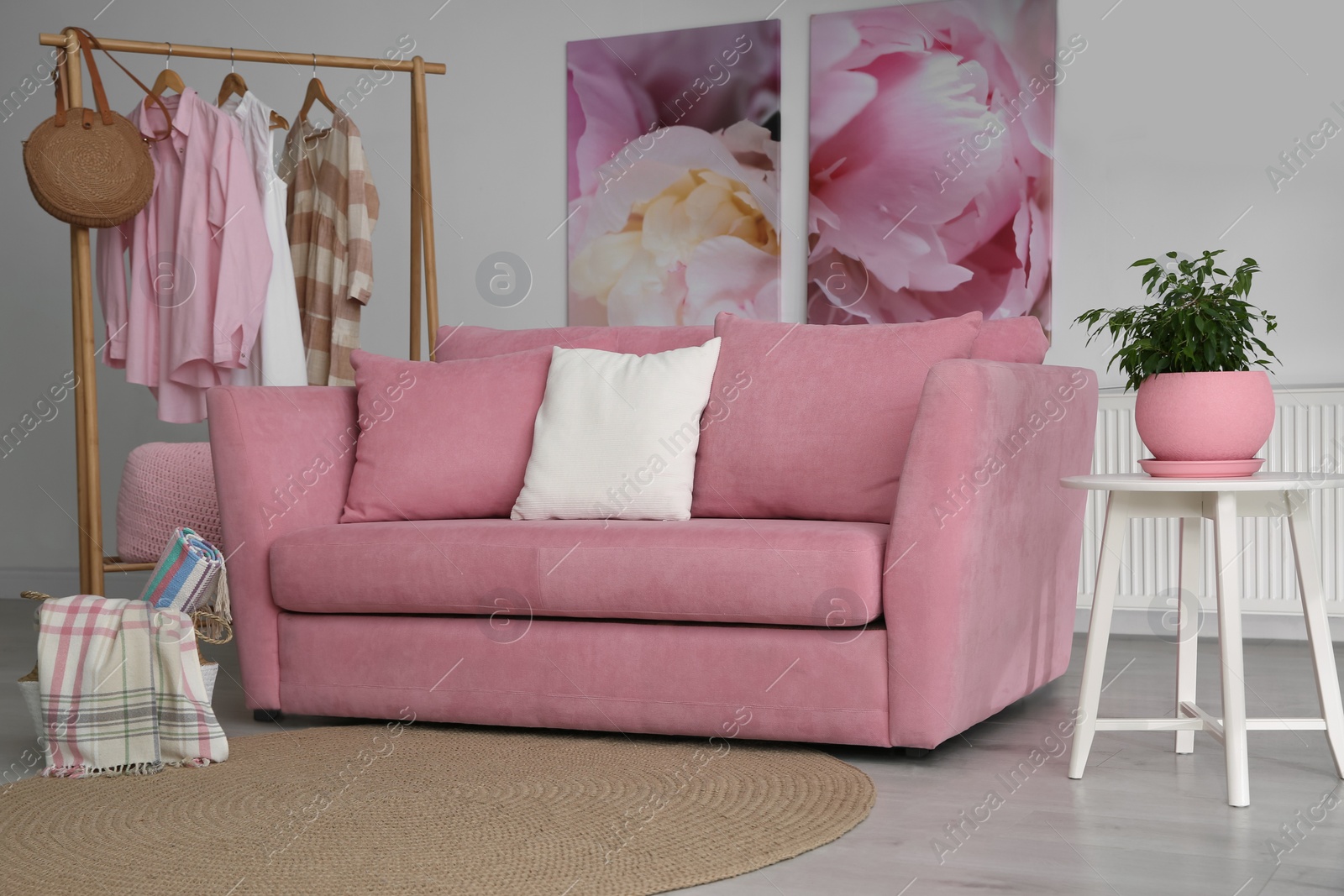 Photo of Modern comfortable sofa in stylish living room interior