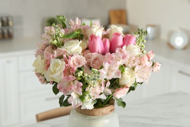 Photo of Beautiful bouquet of fresh flowers in vase indoors