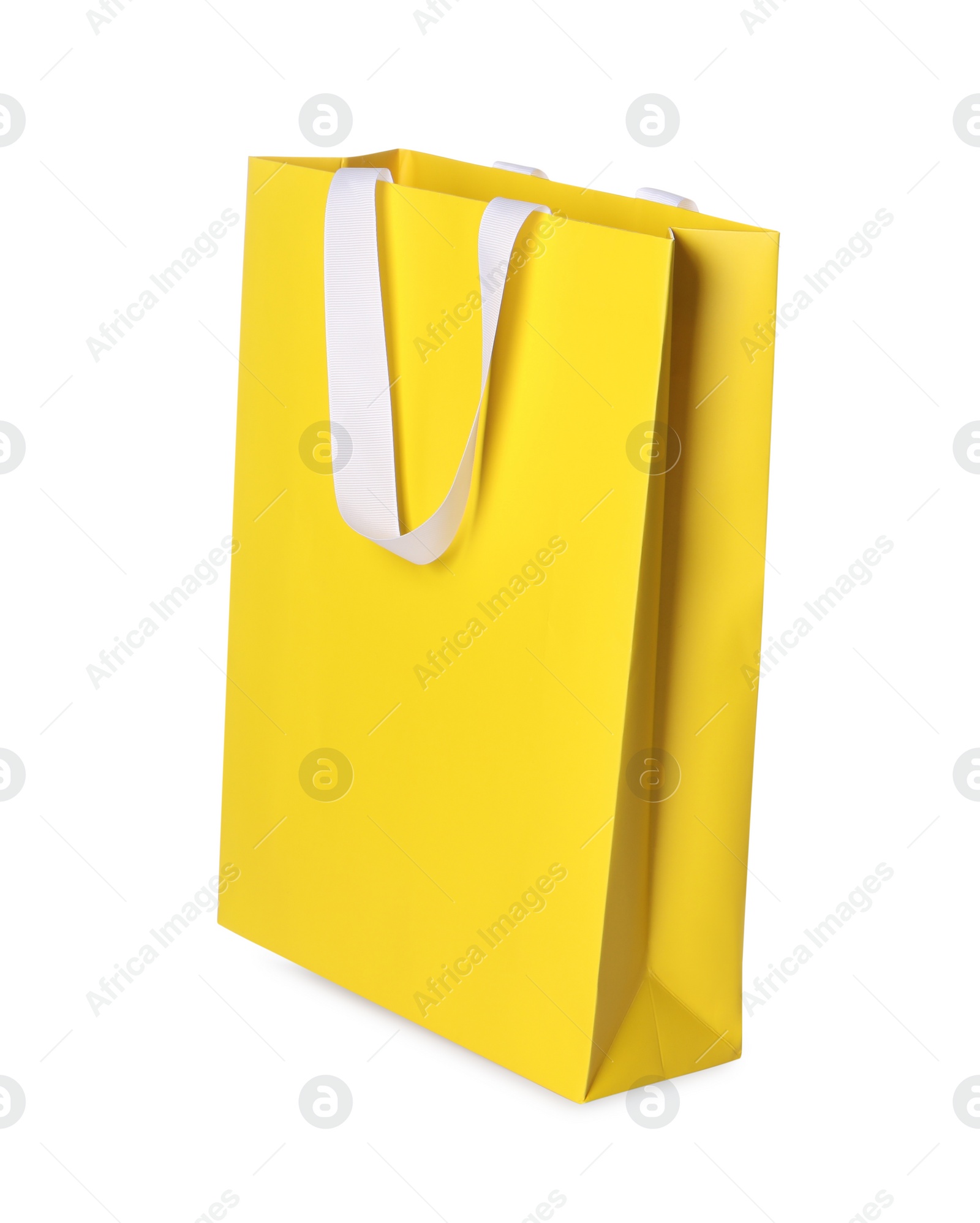 Photo of One yellow shopping bag isolated on white