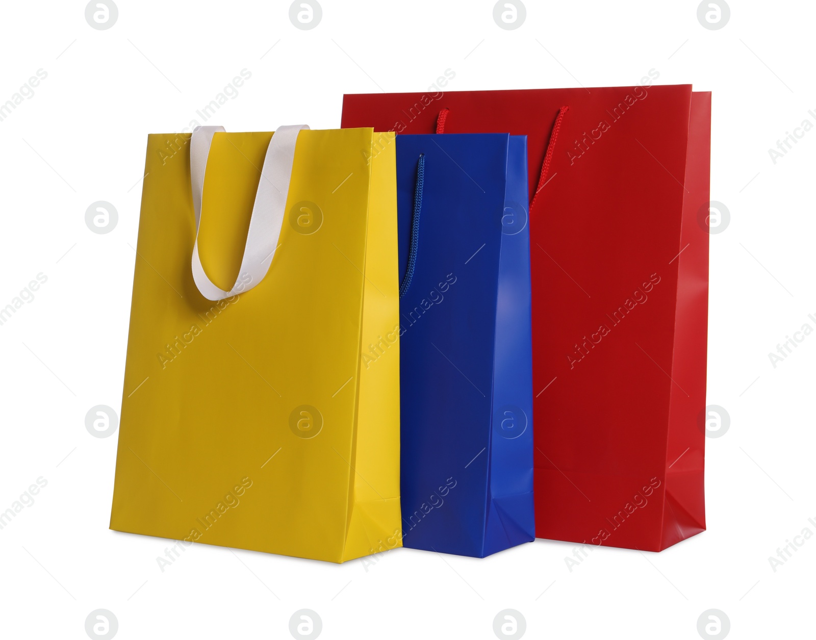 Photo of Colorful paper shopping bags isolated on white