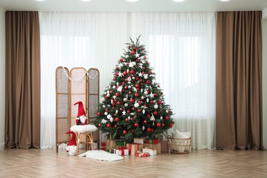 Photo of Cozy room interior with Christmas tree, gifts and beautiful festive decor