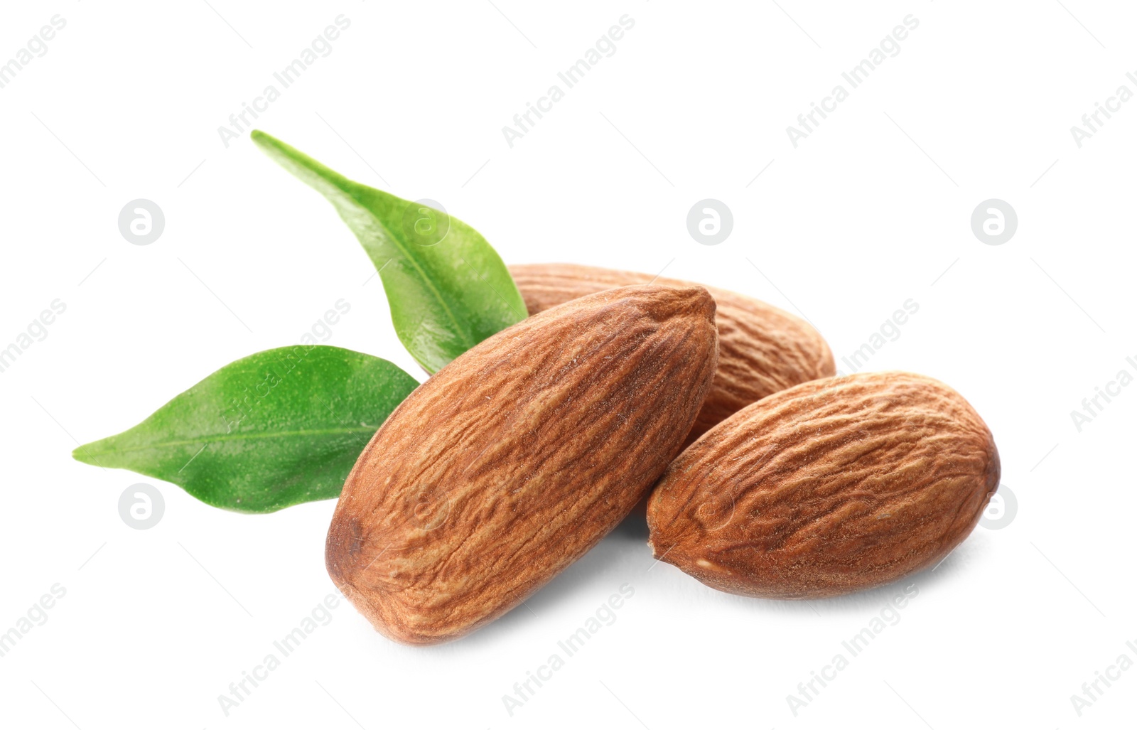 Photo of Organic almond nuts and leaves on white background. Healthy snack