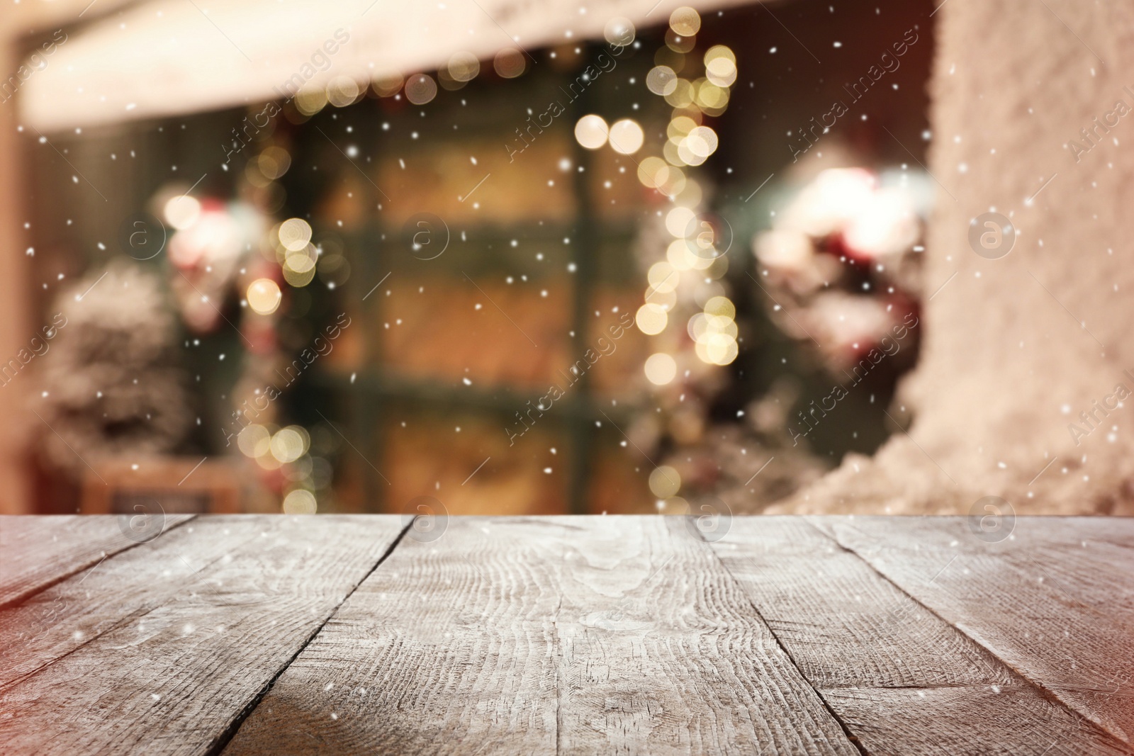 Image of Empty wooden surface against blurred background with bokeh effect. Christmas time