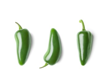 Set with green jalapeno peppers on white background, top view