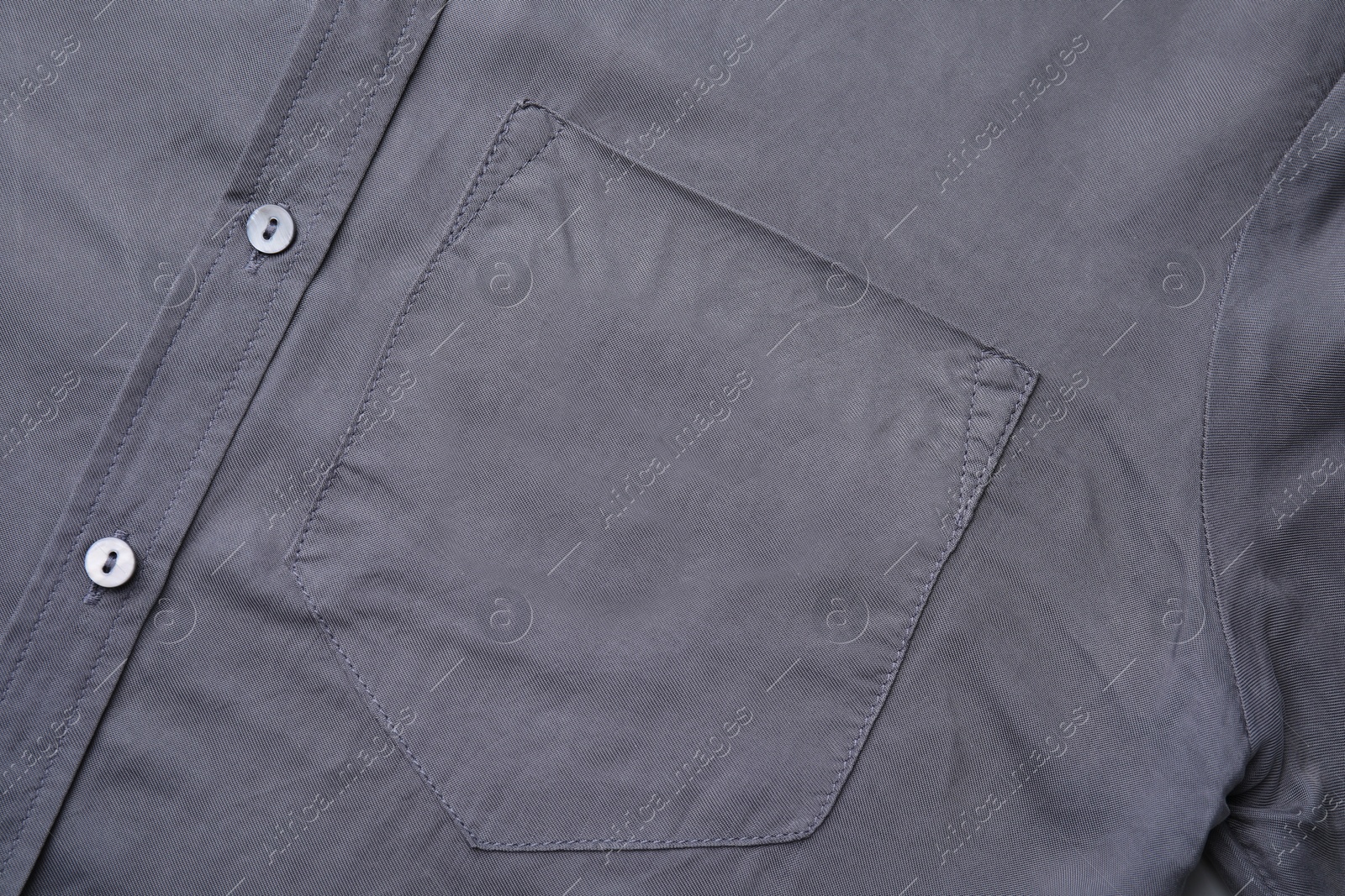 Photo of Gray shirt with pocket as background, top view