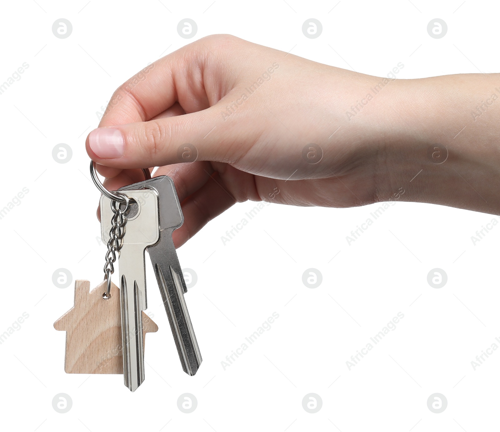 Photo of Woman holding keys with keychain in shape of house isolated on white, closeup