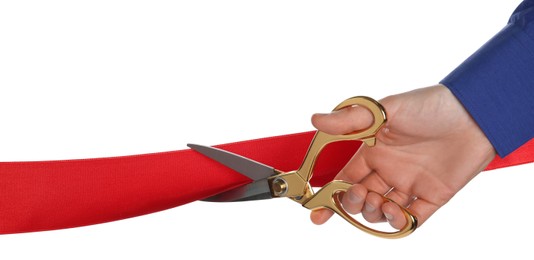 Man cutting red ribbon on white background, closeup