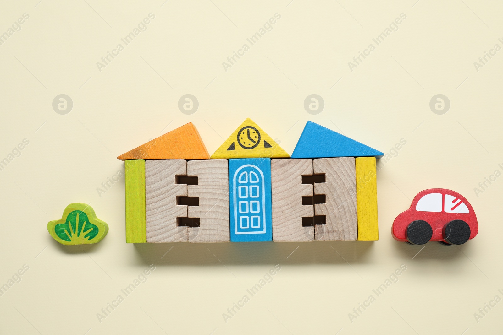 Photo of Set of wooden toys on beige background, flat lay. Children's development