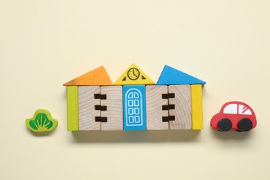 Photo of Set of wooden toys on beige background, flat lay. Children's development