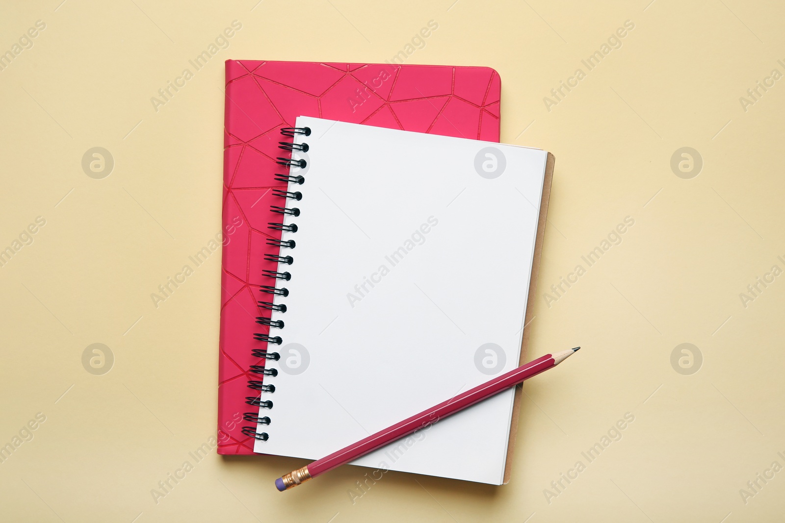 Photo of Flat lay composition with office stationery on beige background. Space for design