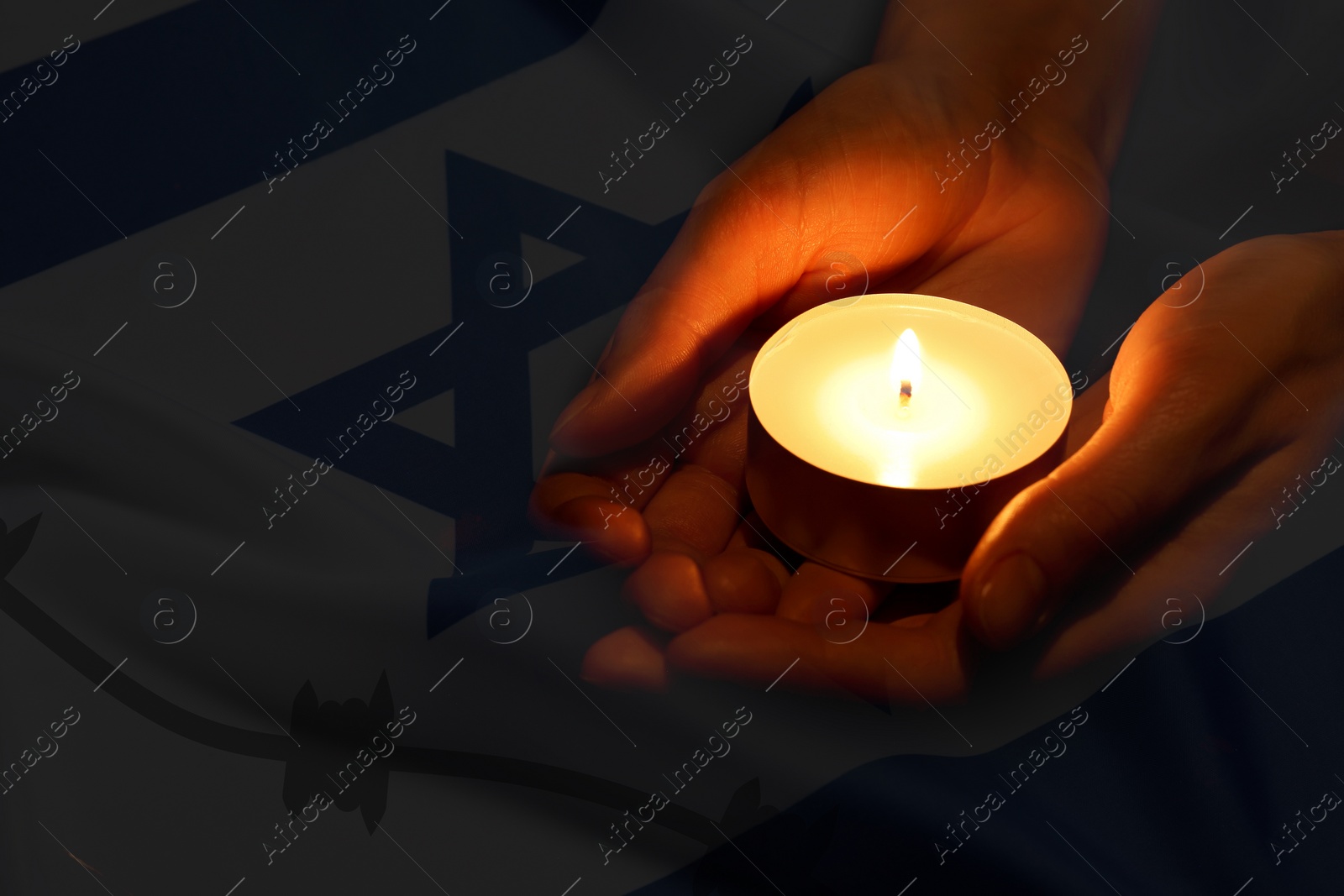 Image of Holocaust Remembrance Day. Double exposure of Israel flag and woman holding burning candle