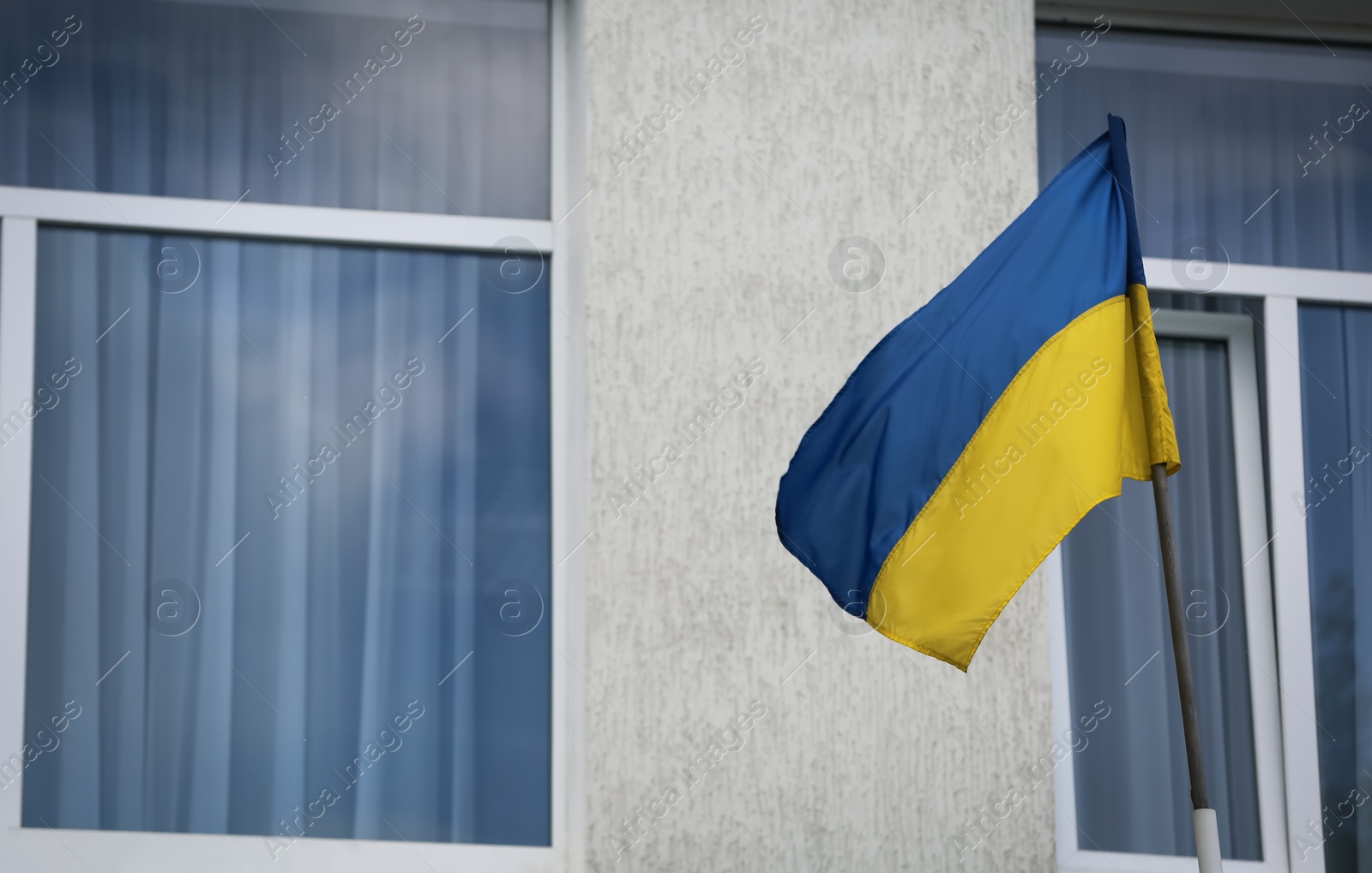 Photo of National flag of Ukraine on building facade