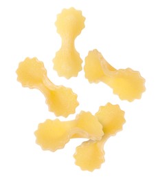 Image of Raw farfalline pasta falling on white background